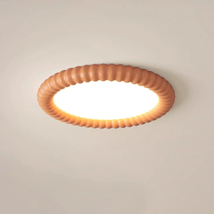 Moderne LED-Deckenleuchte mit dekorativem Wellenrahmen